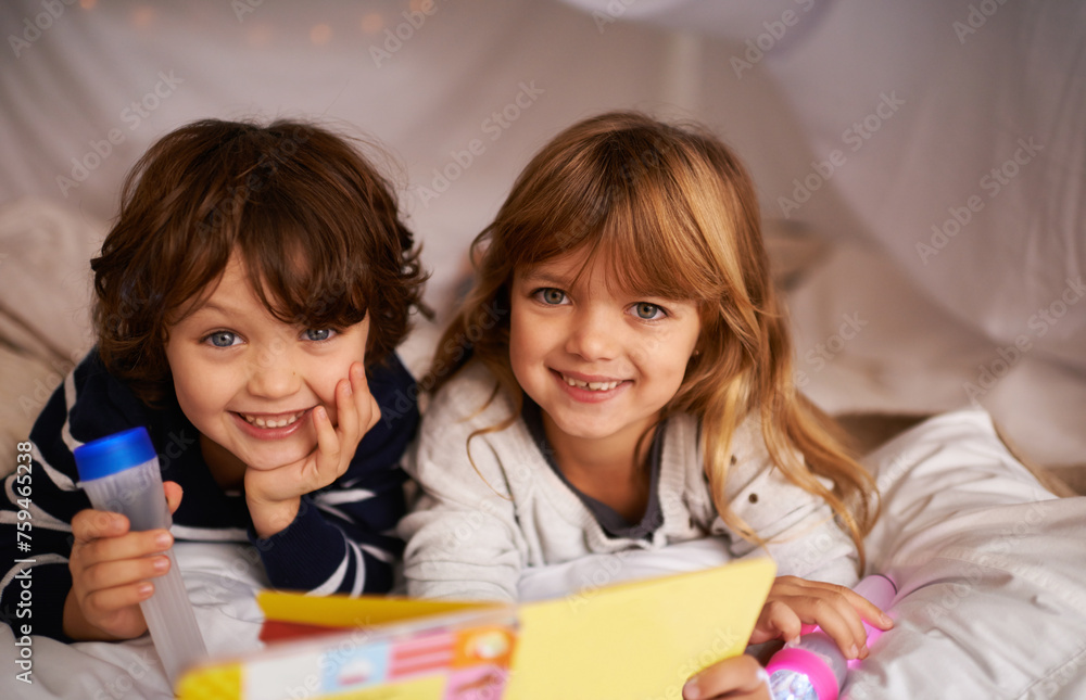 Obraz premium Book, blanket fort and portrait of children reading for knowledge, learning and education with flashlight. Bonding, relaxing and happy young kids enjoying story or novel together in tent at home.