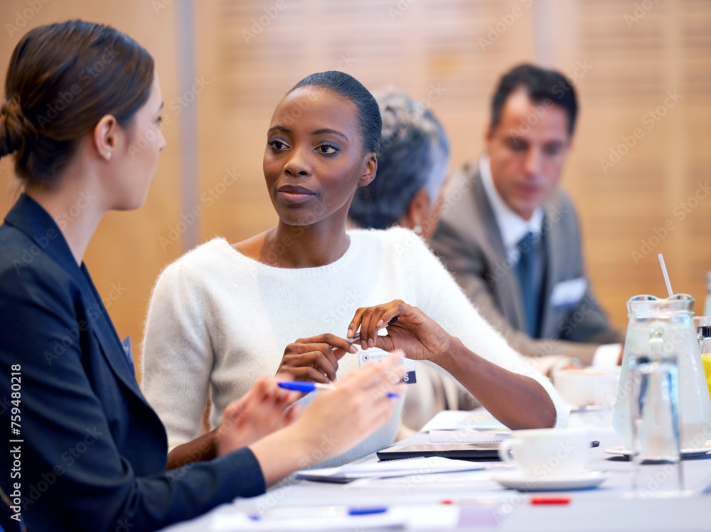 Woman, meeting and discussion with team in conference for planning, strategy or collaboration at the office. Female person, employees or colleagues talking in boardroom conversation at the workplace