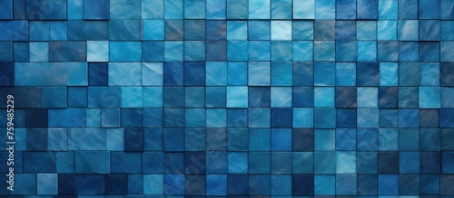 A closeup of the aqua blue glass tile wall showcasing a beautiful pattern of rectangular tiles in various tints and shades of electric blue, creating symmetry and an artistic flooring touch