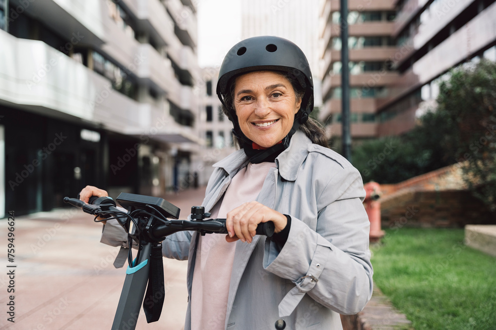 mature woman using electric scooter in the city mature woman using electric scooter in the city
