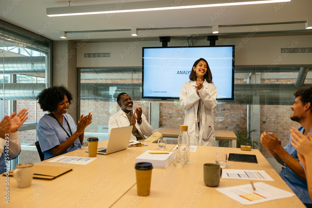 Female doctor having a presentation to medical colleagues Female doctor having a presentation to medical colleagues
