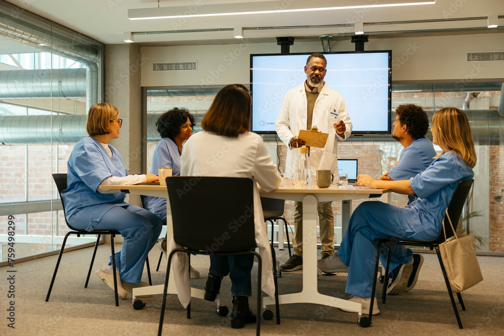 Doctors having a presentation to medical colleagues Doctors having a presentation to medical colleagues