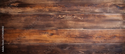Wallpaper Mural A closeup shot of a brown hardwood table with a wood stain, showcasing the beautiful pattern of the wooden plank. The blurred background highlights the rectangle shape of the table Torontodigital.ca