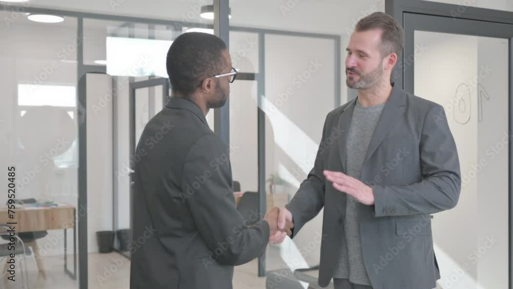 Hand Shake by Multi Ethnic People in Office Hand Shake by Multi Ethnic People in Office
