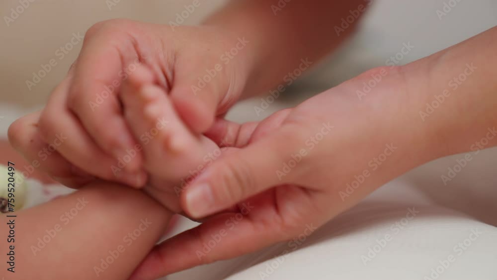 Parents, guardians, family members, Mother or father use fingers to hold Massage the feet of your child, newborn, Mom takes care baby at home. love and care young daughter. Parents, guardians, family members, Mother or father use fingers to hold Massage the feet of your child, newborn, Mom takes care baby at home. love and care young daughter.