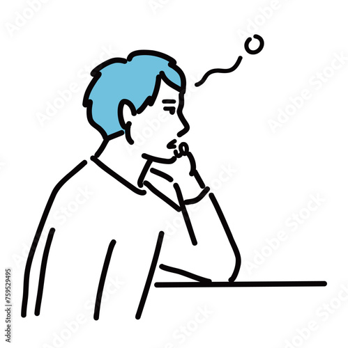 肘をついてぼんやりしている若い男性
