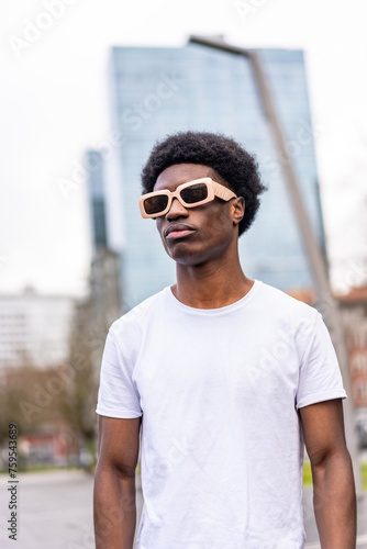Modern african young man in sunglasses and casual clothes