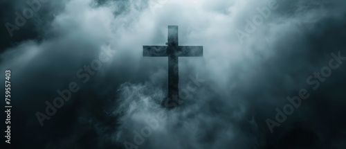  a cross in the middle of a dark cloudy sky with a bright light shining through the clouds on the top of it.