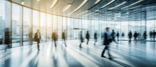 Business people walk in a large office lobby against a cityscape background. Motion blur effect  bright business workplace with people in walking in blurred motion in modern office space