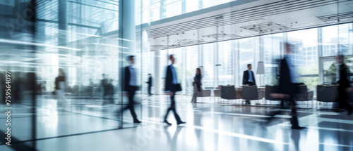 Business people walk in a large office lobby against a cityscape background. Motion blur effect, bright business workplace with people in walking in blurred motion in modern office space © ND STOCK