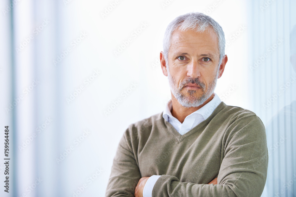 Portrait, arms crossed and confident business man in office, startup company or creative career. Designer, entrepreneur and face of mature person for serious, management or development in workplace Portrait, arms crossed and confident business man in office, startup company or creative career. Designer, entrepreneur and face of mature person for serious, management or development in workplace
