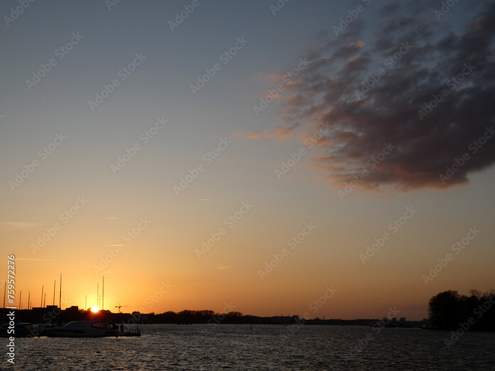 Naklejka premium Beautiful sunset in the city harbor of Rostock (Germany)