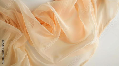 Concept of aesthetic intimate cosmetology, pampering, weight loss, diet. Close up cropped photo of perfect pure beautiful woman's hips and abdomen, covering with chiffon, isolated on white background. photo