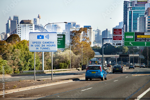 Speed camera in use 24 hours in tunnel road sign in city of Sydney photo