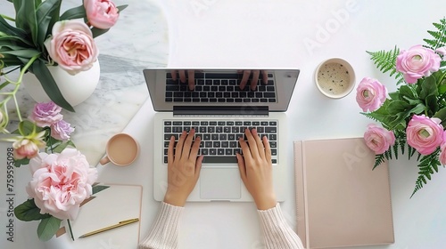 Female hands working on modern laptop. Office desktop on white background photo