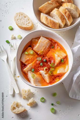 Delicious and fresh pickled herring with tomatoes in oil