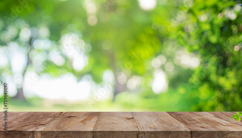 Nature background, Wood table for food and product display over blur green tree garden