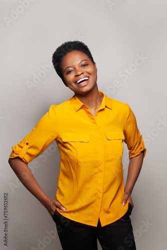 Attractive successful woman smiling and having fun against studio wall banner background
