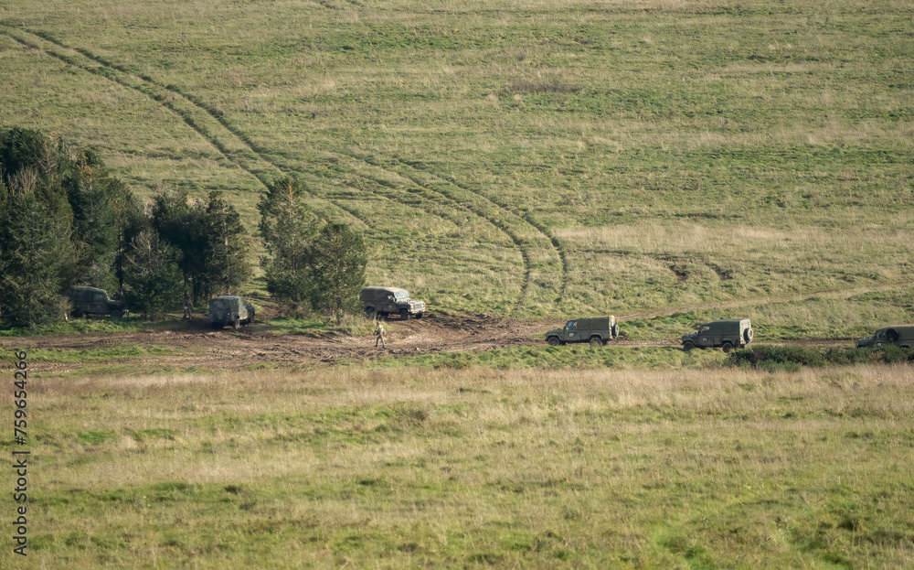 several British army Land Rover Wolf utility vehciles on a military exercise