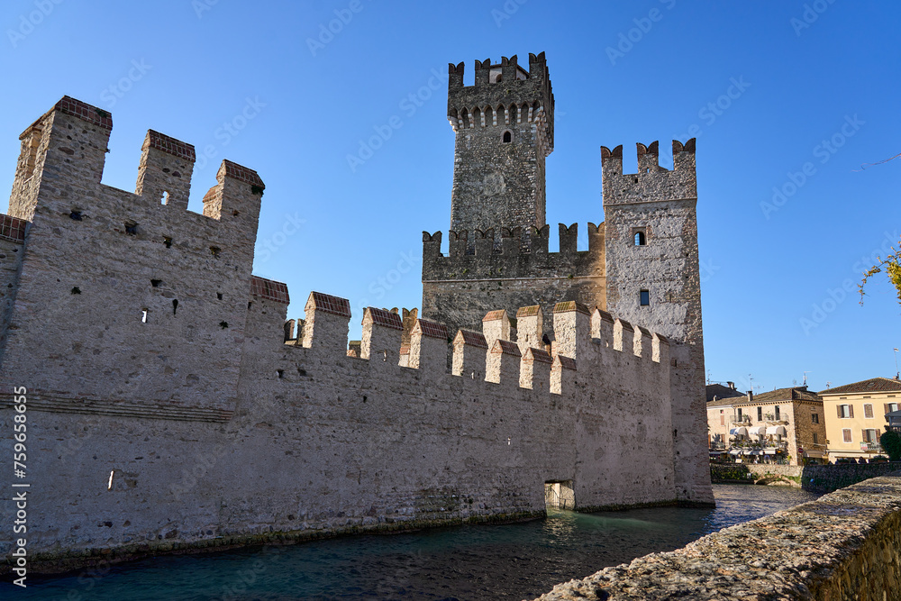 Sirmione castle surrounded by canals with water in 4k Sirmione castle surrounded by canals with water in 4k