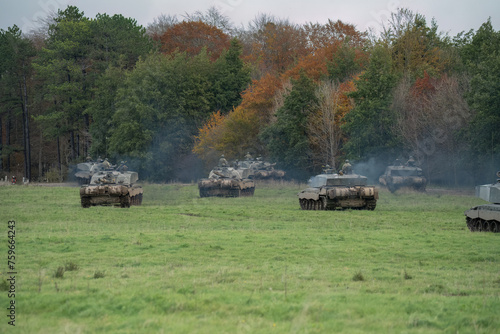 a squadron of British army FV4034 Challenger 2 ii main battle tanks moving out on a military combat exercise, Wiltshire UK