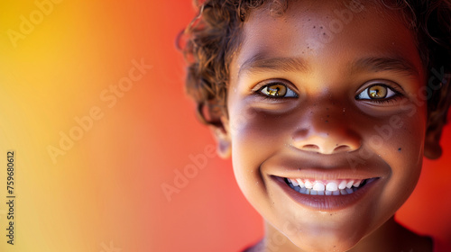 One happy 10 yr old boy student Indigenous Aboriginal Australian kid curl hair black skin diverse positive smile portrait isolated first nation oral dental health child spirituality equality copyspace photo