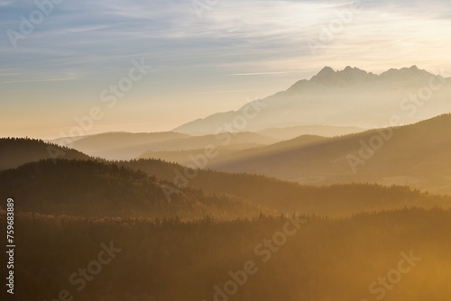 Evening landscape.. There is fog in the valley. View of the Tatra Mountains from the Pieniny Mountain Range. Slovakia.