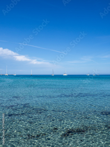 Villasimus, Sardegna. The wonderful bay of Porto Giunco. Sea in shades of turquoise blue. Tourist destination. Sea of Sardinia one of the most beautiful in Italy. Boats off the coast © Matteo Ceruti