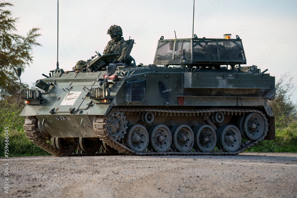soldier commanding a british army Bulldog FV432 tank in motion, Wiltshire UK soldier commanding a british army Bulldog FV432 tank in motion, Wiltshire UK