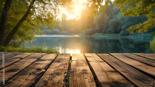 Empty wooden table top with blurred nature background. Calm sunny evening in nature with view to lake  river water and forest  park trees. Table top with copy space for product advertising