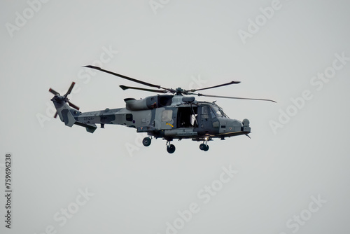 British army AgustaWestland AW159 Wildcat AH1 helicopter in low level flight, Wilts UK photo