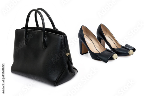 Black women's leather bag and a pair of black high-heeled shoes on a white background