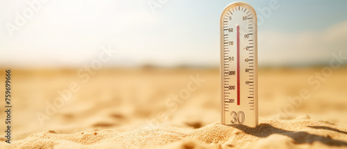 Close up temperature thermometer with high temperature plug on sand on sunny day, Heat stroke. photo