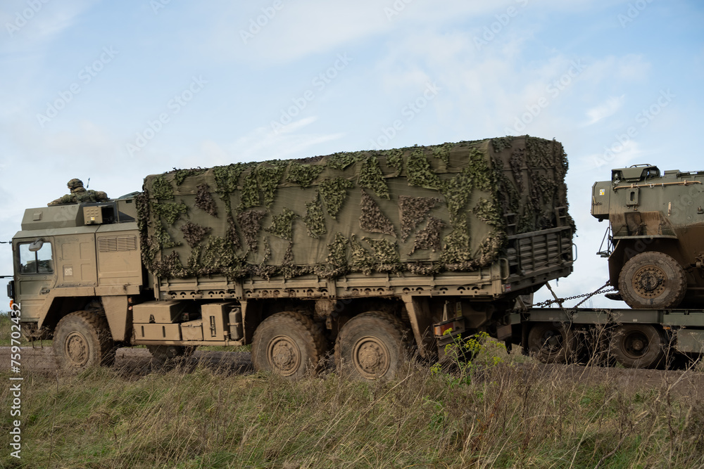 Obraz premium British army MAN HX58 6x6 Heavy Utility Truck EPLS in action on a military exercise