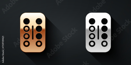 Gold and silver Sedative pills icon isolated on black background. Long shadow style. Vector