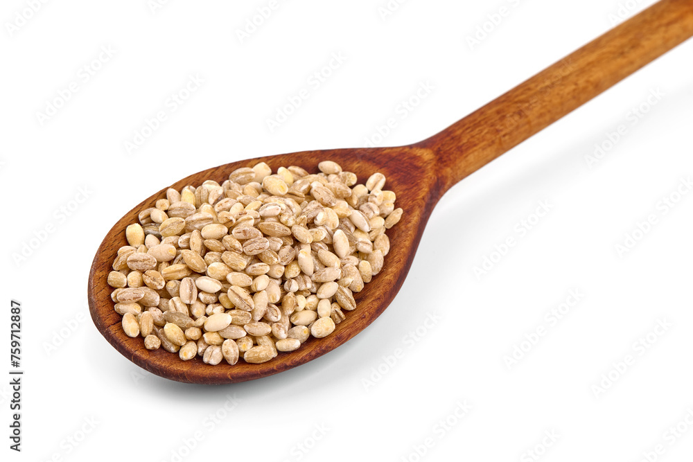 Barley groats on a wooden spoon, isolated on white background. Barley groats on a wooden spoon, isolated on white background.