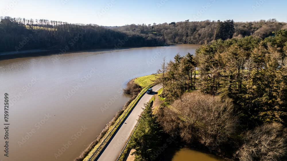 bridge with a car passing over the Jaunay lake in France