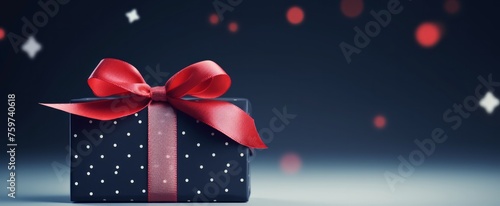 a present with a red ribbon on a blue background