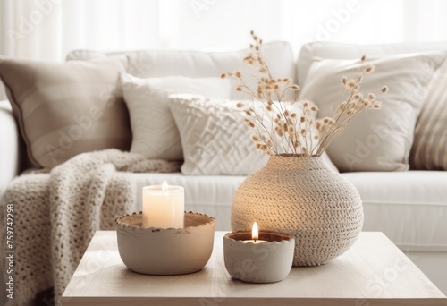 white sofa with candles and pots