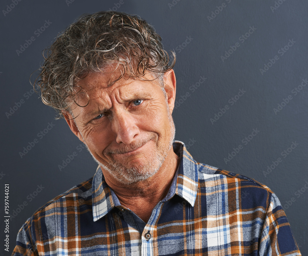 Obraz premium Mature, man and portrait with doubt in studio on dark background with confused questions. Senior, face and unsure person with faq information or guy on mockup space with plaid pattern in fashion