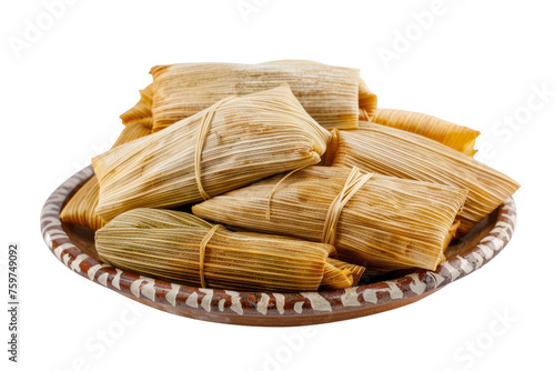 traditional Mexican tamales filled with savory pork and wrapped in corn husks, isolated on a clean white background.