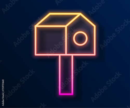 Glowing neon line Bird house icon isolated on black background. Nesting box birdhouse, homemade building for birds. Vector