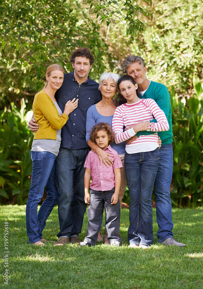 Family, portrait and hug in outdoor park, love and bonding together or happy in backyard. Generations, smile and peace or embrace for support in garden or care, vacation and summer holiday in France Family, portrait and hug in outdoor park, love and bonding together or happy in backyard. Generations, smile and peace or embrace for support in garden or care, vacation and summer holiday in France