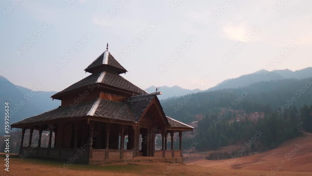Shangchul Mahadev temple against Himalaya mountains in Shangarh, Sainj valley, India. Ancient wooden temple at celestial meadows of Shangarh. Travel and holidays background. Shangchul Mahadev temple against Himalaya mountains in Shangarh, Sainj valley, India. Ancient wooden temple at celestial meadows of Shangarh. Travel and holidays background.