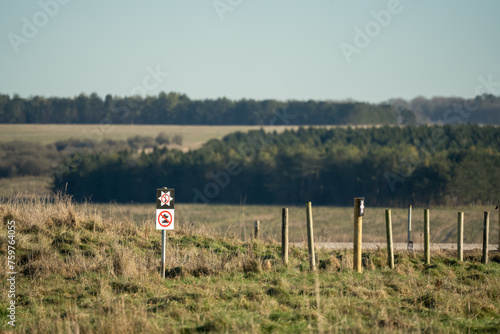 large army metal sign instructing military soldiers not to dig in, or take vehicles across conservation, archeological and historical site, Salisbury Plain military traning area Wilts UK photo