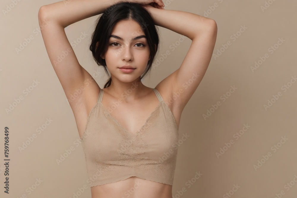 Armpit epilation or Laser hair removal concept. Beautiful young woman showing her armpit on a beige background with copy space. Armpit epilation or Laser hair removal concept. Beautiful young woman showing her armpit on a beige background with copy space.