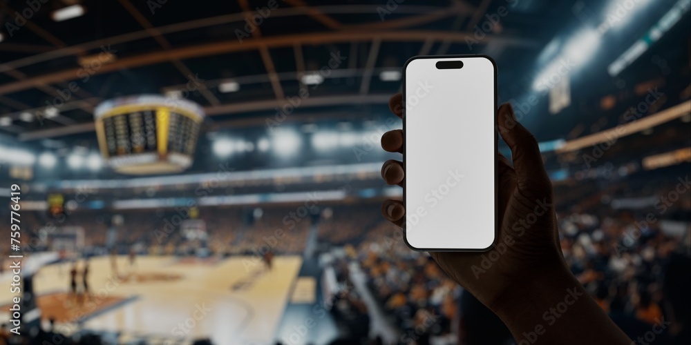 Black African-American man using smartphone during a game on basketball arena - obrazy, fototapety, plakaty 
