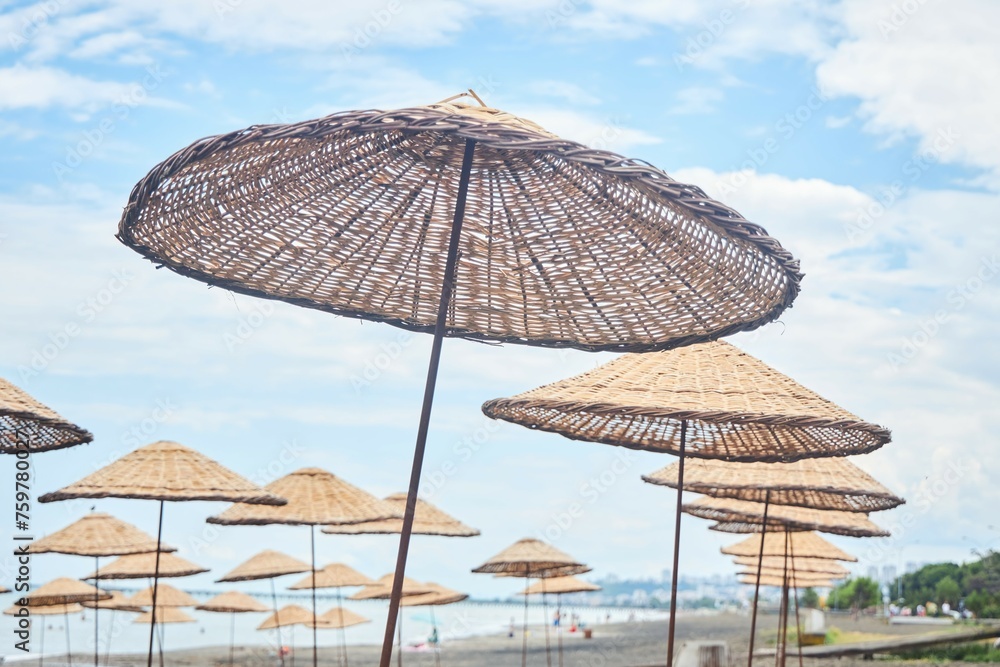 Sandy beach and beach umbrellas. Beach holidays