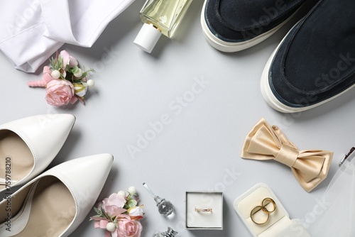 Wedding stuff. Flat lay composition with stylish boutonniere on light gray background, space for text