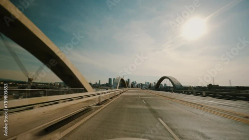 Cars driving across the 6th Street Viaduct into Los Angeles, California. Pov car driving along the iconic 6th Street viaduct.  photo